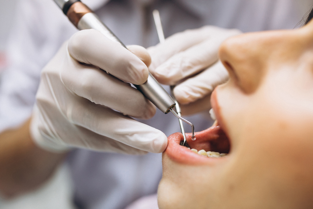 Dentist providing root canal treatment